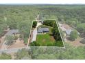Aerial view outlining property lines of a beautiful home surrounded by a lush green landscape and mature trees at 9783 Sw 206Th Court Rd, Dunnellon, FL 34431