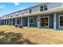 A covered back patio with air conditioning units sits off of an outdoor lawn at 5240 Luisa Ct, St Cloud, FL 34771