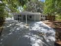 Spacious backyard with covered parking and concrete patio at 2827 Se 2Nd St, Ocala, FL 34471