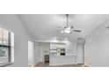 Open-concept living area with a view of the kitchen, creating an ideal space for entertaining at 4856 Colonnades W Cir, Lakeland, FL 33811