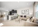 Open-concept living area features a spacious layout connecting the kitchen, dining, and living spaces at 1196 Port Blue Way, Lady Lake, FL 32159