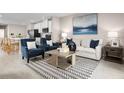 Open-concept living room with lake views and stylish furniture and decor at 1252 Turtle Island Rd, Lady Lake, FL 32159