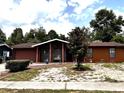 Exterior of a lovely home with tidy landscaping, mature trees, and a peaceful suburban setting at 14545 Sw 34Th Terrace Rd, Ocala, FL 34473