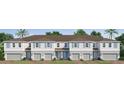 New townhomes featuring modern design, light grey siding, and inviting garages at 1145 Red Buckeye Ct, Deland, FL 32720