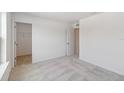 Neutral bedroom with plush carpeting, an open closet, and ample natural light at 5281 Luisa Ct, St Cloud, FL 34771