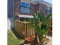 Private patio area with wooden fence offering a secluded outdoor space at 2200 S Palmetto Ave # E050, South Daytona, FL 32119