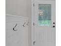 Entryway featuring coat rack, a transom window, and neutral paint at 3207 Cr 419, Lake Panasoffkee, FL 33538