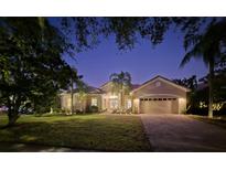 Stunning single-story home with a two-car garage and beautifully landscaped lawn at 2621 Lookout, Kissimmee, FL 34746