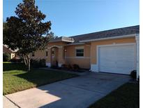 Charming single story home with a well-manicured front yard and attached one car garage at 3110 Port Royal Dr, Orlando, FL 32827