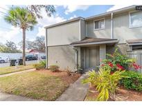 Inviting condo exterior with a well-maintained lawn and walkway at 4537 Ring Neck Rd # C, Orlando, FL 32808