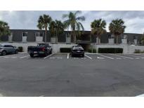 Exterior view of building with parking lot including accessible parking and mature landscaping at 1928 Conway Rd # 23, Orlando, FL 32812