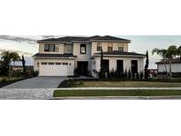 Beautiful two-story home with a two-car garage, landscaped front yard, and a well-maintained lawn at 16832 Bolsena Dr, Bella Collina, FL 34756