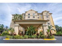 The StaySky Suites I-Drive Orlando entrance showcases tropical landscaping and grand columns at 7601 Canada Ave # 623, Orlando, FL 32819