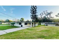 Inviting one-story home featuring well-maintained landscaping and a charming covered entryway at 101 Ellison Ave, New Smyrna Beach, FL 32168