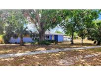 Cozy home with mature trees in the front yard at 902 S Scenic Hwy, Lake Wales, FL 33853