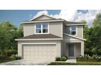 Charming two-story home featuring a 2-car garage, neutral siding, complemented by lush landscaping and a well-maintained lawn at 5133 Forget Me Not Ave, Lake Hamilton, FL 33851