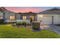 Charming single-story home featuring a well-manicured lawn and inviting front entrance at 2049 Se 37Th Court Cir, Ocala, FL 34471