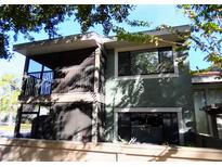 Two-story exterior with a balcony and neutral tones, offering a welcoming curb appeal at 5127 Eaglesmere Dr # A02, Orlando, FL 32819