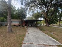 Charming single-story home with a covered carport and spacious front yard at 725 6Th Ne St, Fort Meade, FL 33841
