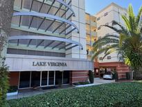 Attractive low-rise building featuring prominent signage and well-maintained landscaping at 690 Osceola Ave # 405, Winter Park, FL 32789