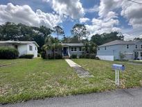 Charming single-story home with well-kept front lawn and landscaping at 2094 Penn Dr, Deland, FL 32724