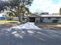 Ranch-style home with carport and fenced yard at 217 Bay E St, Davenport, FL 33837