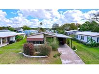 Charming single-story home with a well-maintained lawn and driveway at 470 Village Sw Cir, Winter Haven, FL 33880