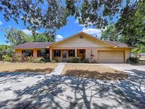 Charming single-story home with a well-manicured lawn, attached garage, and inviting front entrance at 1600 Alma Ct, Bartow, FL 33830