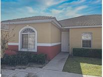 Charming one-story home featuring a well-maintained lawn and welcoming entryway at 184 Ocean Bluff Dr, Poinciana, FL 34759