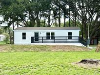 Charming single-story home with a spacious front yard and inviting front porch at 6611 Glen Meadow Loop, Lakeland, FL 33810