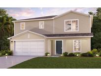 Charming two-story home featuring a two-car garage, well-maintained lawn and traditional design at 3445 Dahlia Dr, Haines City, FL 33844