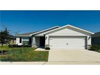 Curb appeal abounds in this charming one-story home! at 724 Caribbean Dr, Mulberry, FL 33860