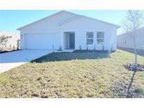 New construction home featuring a two-car garage and minimalist landscaping at 2491 Nw 23Rd Ave, Ocala, FL 34475