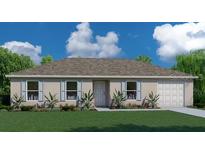 Charming single-story home with a well-manicured lawn, lovely landscaping, and attached two-car garage at 17085 Sw 40Th Ter, Ocala, FL 34473