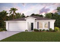 Charming single-story home with a two-car garage, manicured lawn, and neutral-colored exterior at 2416 Nw 22Nd Ct, Ocala, FL 34475