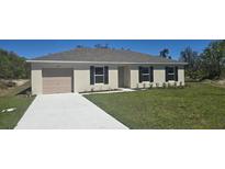 Charming one-story home with a well-manicured lawn and neutral color palette at 422 St Johns Ln, Poinciana, FL 34759