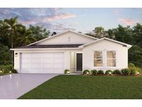 Charming single-story home with a well-manicured lawn and a two-car garage under a twilight sky at 12989 Se 53Rd Ave, Belleview, FL 34420