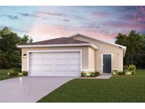 Charming one-story home with a two-car garage, well-manicured lawn, and inviting curb appeal at 2012 Golden Beak Dr, Eagle Lake, FL 33839