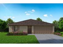 Charming single-story home featuring a well-manicured lawn, a two-car garage, and inviting curb appeal at 367 Bowfin Ct, Poinciana, FL 34759