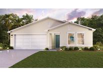 Charming single-story home with a two-car garage, well-manicured lawn, and inviting front entrance at 2353 Oklahoma Dr, Sumterville, FL 33585