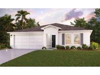 Charming one-story home showcasing a two-car garage, dark shutters, and beautiful landscaping at 1318 Howland Blvd, Deltona, FL 32738