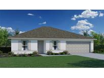 Charming one-story home featuring a well-manicured lawn, two-car garage and neutral toned facade at 16006 Sw 55Th Avenue Rd, Ocala, FL 34473