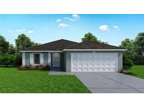 Charming one-story home with a two-car garage, manicured lawn, and neat landscaping at 1823 Hudson Ct, Poinciana, FL 34759