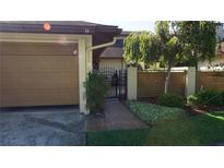 Charming home exterior with garage, walkway and lush landscaping at 925 Fenton Ln # 11, Lakeland, FL 33809