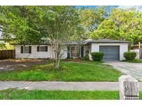 Charming single-story home with a lush front yard and attached one car garage at 1586 Fergason Ave, Deltona, FL 32725