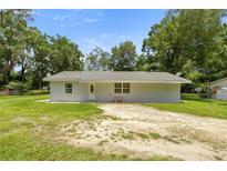 Charming single-story home with a well-maintained lawn and inviting front entrance at 1143 Ne 23Rd St, Ocala, FL 34470