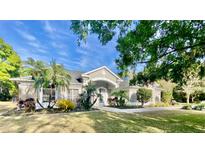 Charming one-story home with meticulously landscaped front yard and inviting entrance at 5701 John Anderson Hwy, Flagler Beach, FL 32136