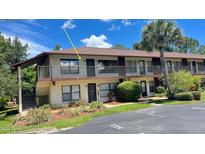 A charming condo building with well-maintained landscaping and a welcoming facade, ideal for comfortable living at 108 Lacosta Ln # 621, Daytona Beach, FL 32114