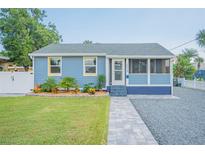 Charming blue house with landscaped yard and walkway at 2110 N Oleander Ave, Daytona Beach, FL 32118