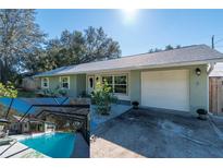 Newly renovated single story home with a large yard and attached garage at 5700 E Fort King St, Ocala, FL 34470